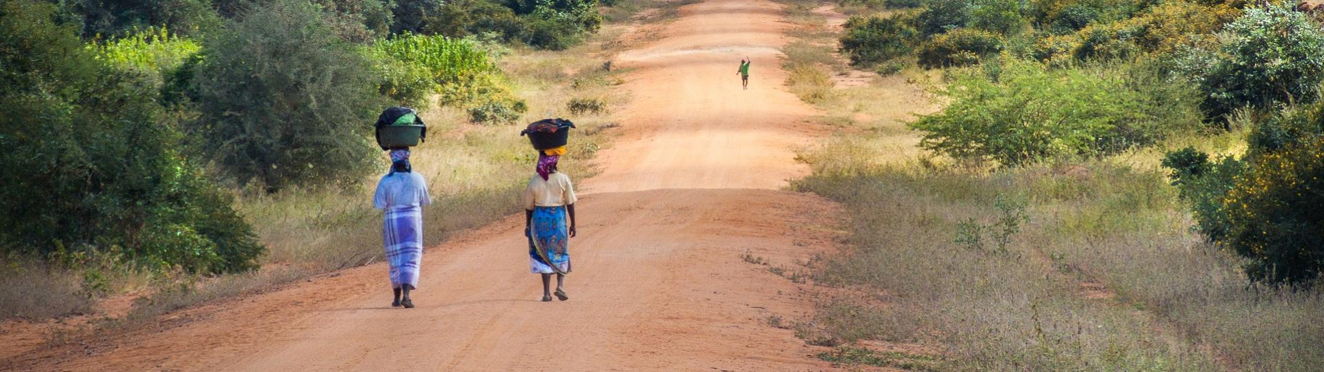 African women walking along a road