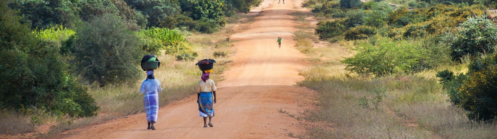 African women walking along road